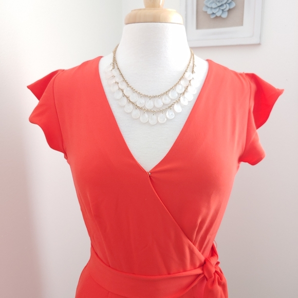 (SOLD) Ann Taylor Coral Ruffle Short Sleeve Plunge Belted Tie Waist Romper - Picture 2 of 8